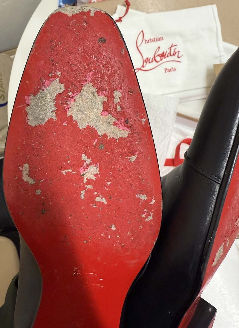 Worn Louboutin sole showing lacquer worn through to leather